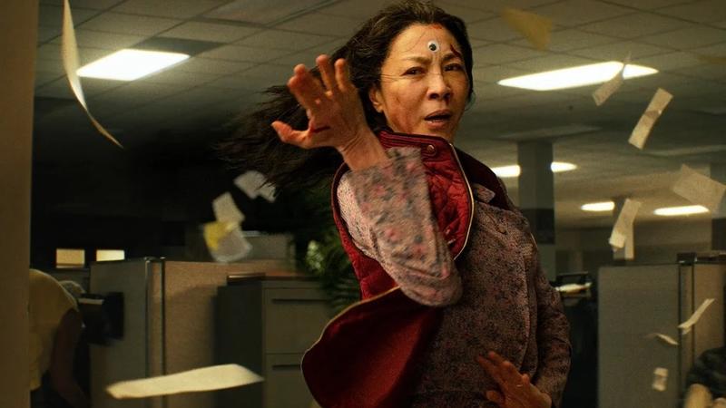 Michelle Yeoh stars as a woman who suddenly develops the power to leap between parallel universes in the action-adventure-fantasy <em>Everything Everywhere All at Once.</em>