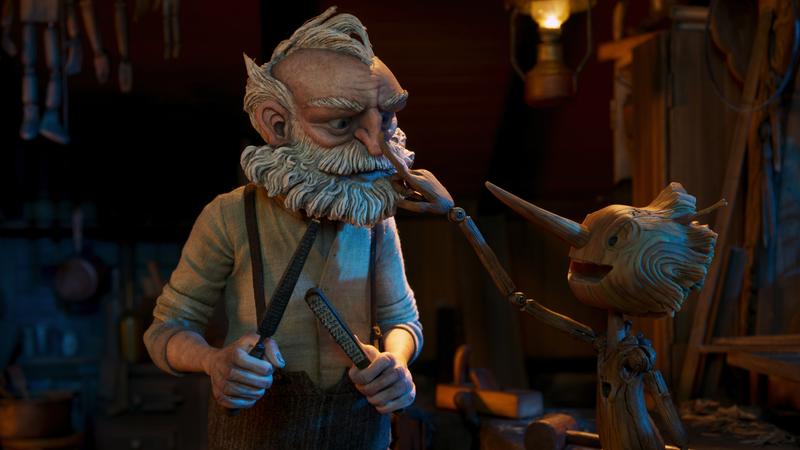 Gepetto (voiced by David Bradley) and <em>Pinocchio</em> (voiced by Gregory Mann).