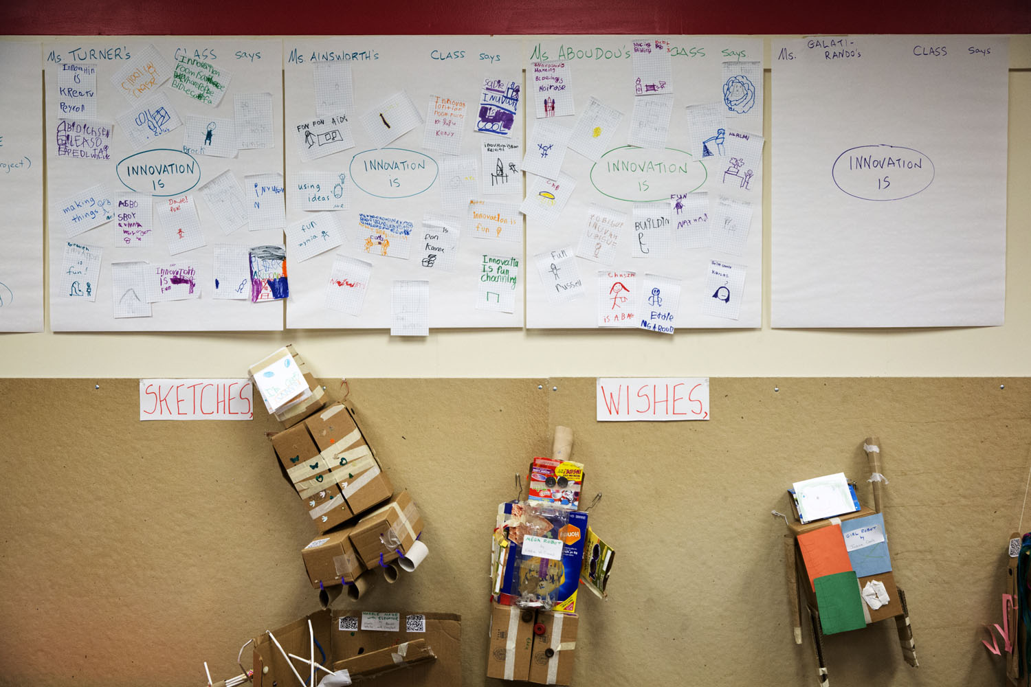 A wall in the “innovation” class is covered with notes from students explaining their own definitions of innovation.